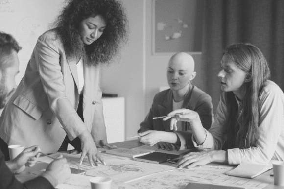 Marketing officer discussing a marketing campaign with her team members.