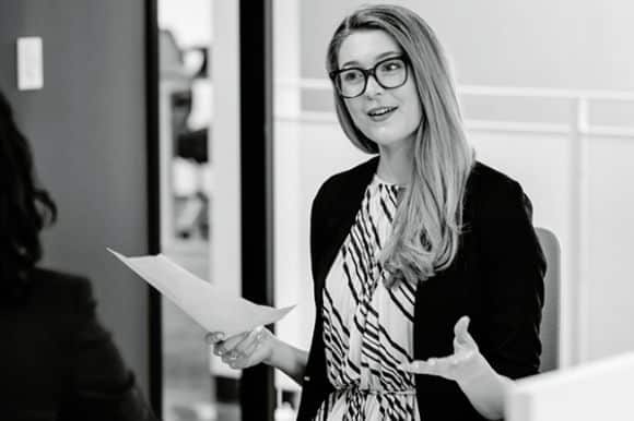 A manager conducting a stay interview, which is just one part of a comprehensive employee retention strategy.